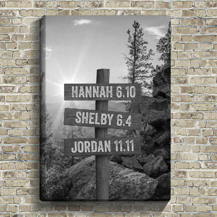 Black and white canvas wall art personalized with up to 12 custom kid names. Black and white mountain landscape digital painting with wooden mountain street sign post with family names or make your own motivational quote on canvas.