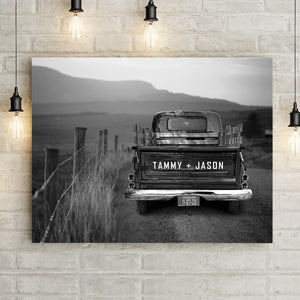 Black and white vintage truck wall art custom canvas print. Classic truck tailgate is personalized with names, and license plate is personalized with custom text and/or date. Vintage truck canvas art is on an old dirt country road landscape. Add Optional text including Thankful Grateful Blessed Wall Art with optional Broken Road Quote. Choose from medium, large, or extra large canvas wall art sizes. Pefect gift for classic truck lover.