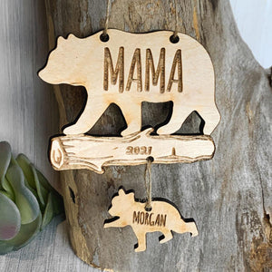 https://lemonsareblue.com/cdn/shop/products/mama-bear-mom-first-christmas-ornament-for-new-mother-2021-cub-cutout_300x.jpg?v=1634550183