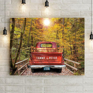Custom Vintage Truck Wall Art Canvas Print with Personalized Couple Names on Truck Tailgate and Wedding Date on License Plate. Choose Blue, Green, or Antique Red Vintage Truck Canvas parked on a country road over a bridge through the woods on this custom canvas wall decor. Large wall art makes a Beautiful Custom Anniversary Gift or Personalized Wedding Gift. 